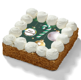 Kerst slagroomtaart met logo met slagroomtoefjes, nougatine rand en feestelijke kerstdecoratie.